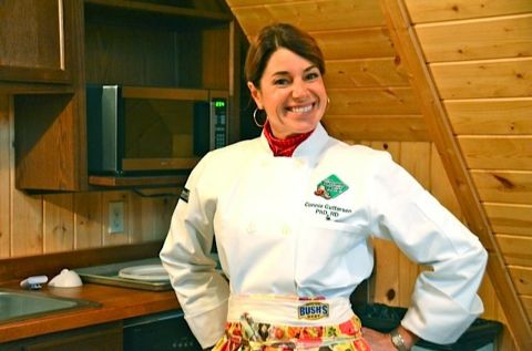 Connie Guttersen smiling as a pose in  the photo